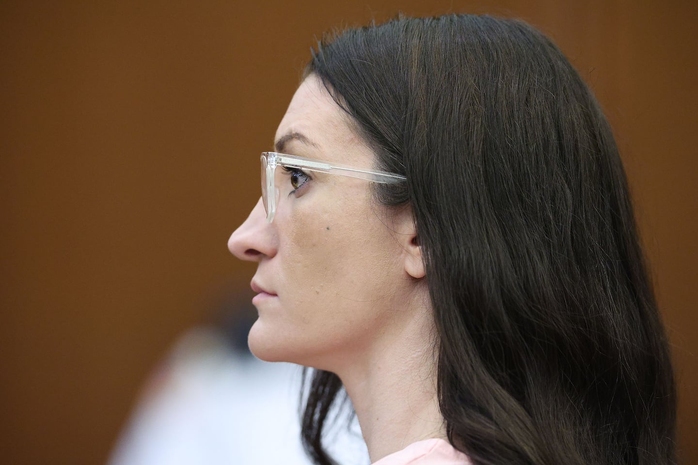 Defendant Lindsay Clancy listens to Dr. Jennifer Tufts on the witness stand.
