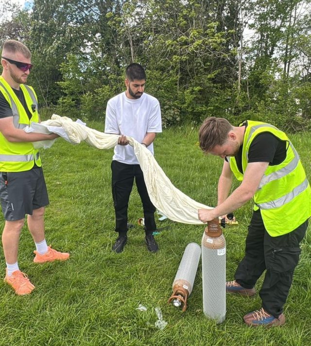 The Zoomi team, filling the balloon. // A dog's ashes were launched 119,000ft and scattered in space. Oscar, a six-year-old French bulldog who died suddenly from a brain tumour earlier this year, has been given one final adventure after his ashes were sent to the edge of the atmosphere in a weather balloon. His favourite Toy Story alien plush and a pet GPS tracker travelled to the edge of Earth's atmosphere in a weather balloon tribute on May 7, 2026. His owner, Jacob Battersby, 26, from Stockport, and friend Callum King, 26, from Rugby, launched the balloon from Rugby, Warwickshire.