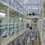 A view of the landings of E wing inside HMP Wandsworth, London, United Kingdom. The prison install netting between floors to prevent inmates from jumping from the balcony to commit suicide. Wandsworth is the largest prison in the UK, currently able to hold 1665 prisoners. Alongside Liverpool, which is of similar size, it is one of the largest prisons in Western Europe. The prison was built in 1851. (Photo by Andrew Aitchison/In Pictures Ltd./Corbis via Getty Images)