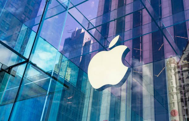 New York City, United States - September 27, 2016: Glass building of the Apple Store with huge Apple Logo at 5th Avenue near Central Park. The store is designed as the exterior glass box above the underground display room