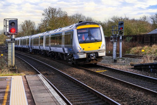 February 8th. 2024. A diesel powered passenger commuter train stops at Hatton Station Warwickshire England UK. It is a bright day and there are no visible people in the picture.