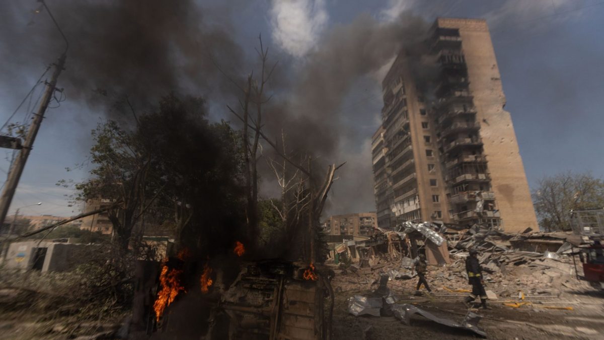 KRAMATORSK, UKRAINE - AUGUST 04: Firefighters extinguish a fire involving a vehicle and a building following a Russian airstrike in Kramatorsk, Ukraine, on August 04, 2026. (Photo by Francisco Richart/Anadolu via Getty Images)