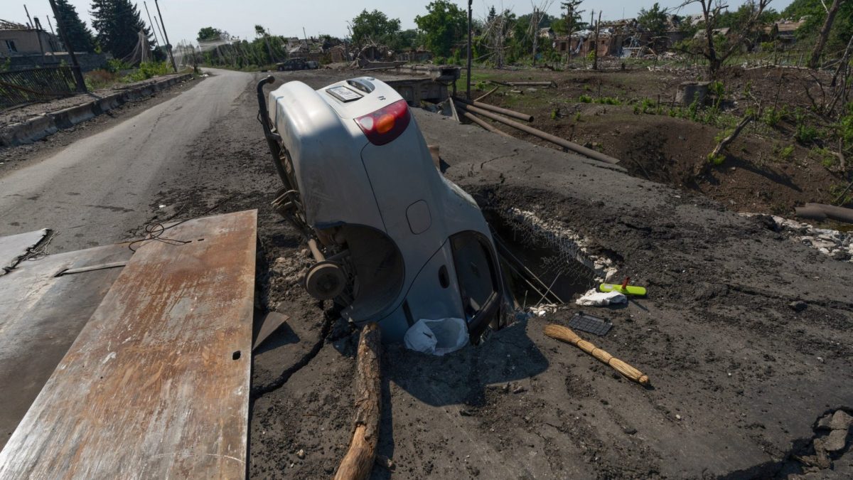 In this photo provided by Ukraine's 93rd Kholodnyi Yar Separate Mechanized Brigade press service and taken Monday, Aug. 10, 2026, a damaged road caused by regular shelling is seen in the frontline town of Druzhkivka, Donetsk region, Ukraine. (Iryna Rybakova/Ukraine's 93rd Mechanized Brigade via AP)