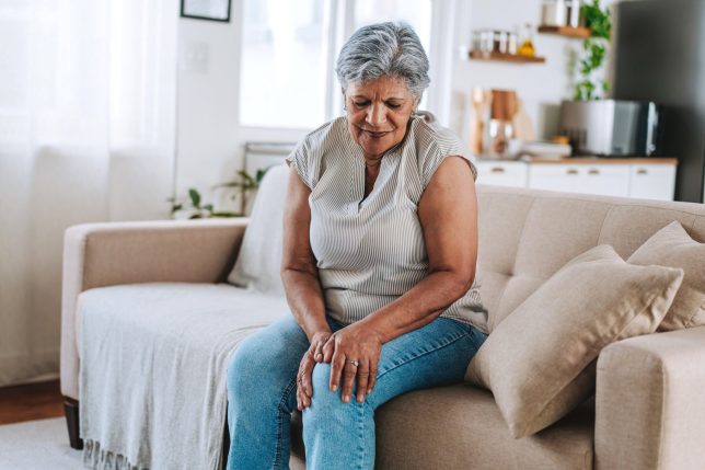 Mature Woman Suffering From Knee Pain Or Arthritis