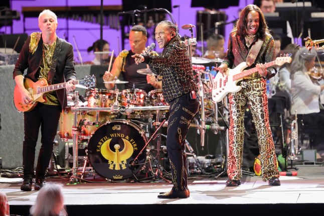 LOS ANGELES - SEPTEMBER 21: A GRAMMY SALUTE TO EARTH, WIND & FIRE LIVE: THE 21ST NIGHT OF SEPTEMBER will air Sunday, Sept. 21 (8:00-10:00 PM, ET/PT) on the CBS Television Network and stream on Paramount+. Legendary band and one of the best-selling artists of all time, Earth, Wind & Fire take to the Hollywood Bowl stage for a once-in-a-lifetime musical event, joined by the world-renowned LA Philharmonic, featuring guests celebrating the nine-time GRAMMY-winning group's enduring legacy, cultural impact and timeless sound. Pictured: John Paris, B. David Whitworth and Verdine White of Earth, Wind & Fire. (Photo by Stewart Cook/CBS via Getty Images)