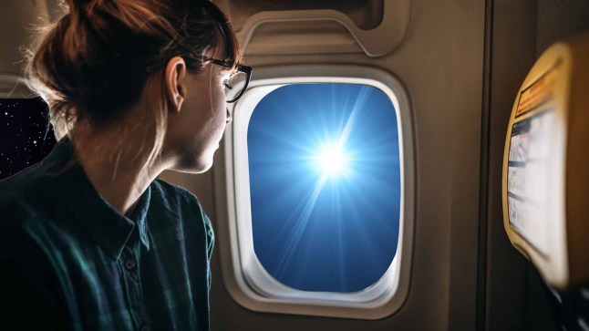 Young Traveler Woman Looking through Airplane Window, Enjoying View