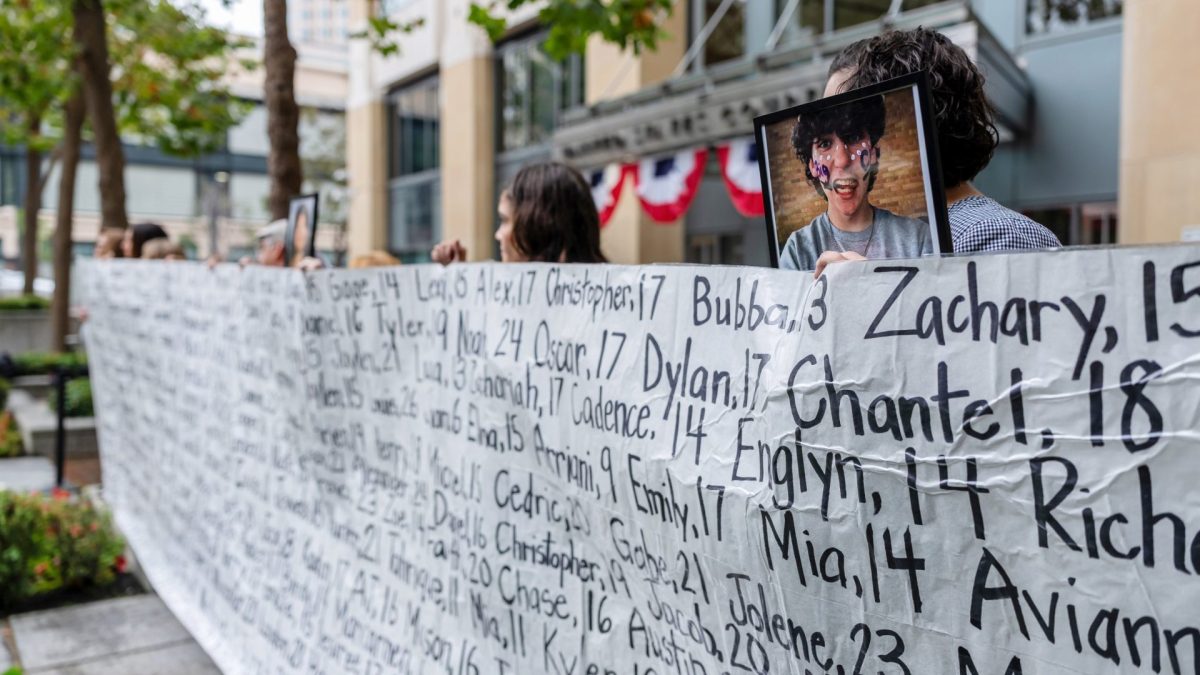 Demonstrators hold a banner with the names of young people who allegedly died due to impacts of social media during a protest outside the Ronald V. Dellums Federal Building & US Courthouse in Oakland, California, US, on Tuesday, Aug. 18, 2026. Meta Platforms Inc. is headed to court Tuesday for a high-stakes showdown with a coalition of state attorneys general over claims that the company deliberately designed Facebook and Instagram to encourage compulsive use among young users. Photographer: David Paul Morris/Bloomberg via Getty Images