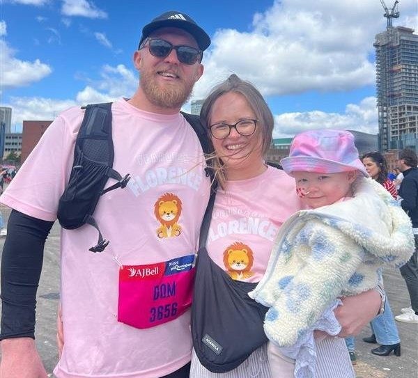 Anna Chattaway and Dom Wilde, with their daughter Florence. // A toddler whose belly ballooned was diagnosed with a 2kg tumour after doctors repeatedly told her parents she was constipated. Florence Wilde, two, was diagnosed with neuroblastoma - a rare cancer of the cell - in November 2024. Her parents Anna Chattaway and Dom Wilde, both 32, first noticed something was wrong when Florence became repeatedly rundown. The toddler's tummy began to swell so the pair rushed her to Three Villages GP in Stourbridge but doctors ruled out the symptoms as constipation, prescribing the tot laxatives. Photo released 21/08/2026