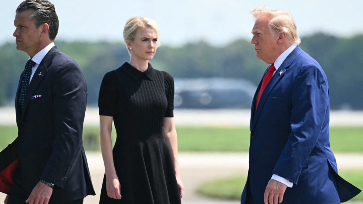 (L/R) US Secretary of Defense Pete Hegseth, White House aide Natalie Harp, and US President Donald Trump attend a dignified transfer solemn event for US service members killed during operations in the Middle East, at Dover Air Force Base in Dover, Delaware, on July 22, 2026. (Photo by SAUL LOEB / AFP via Getty Images)
