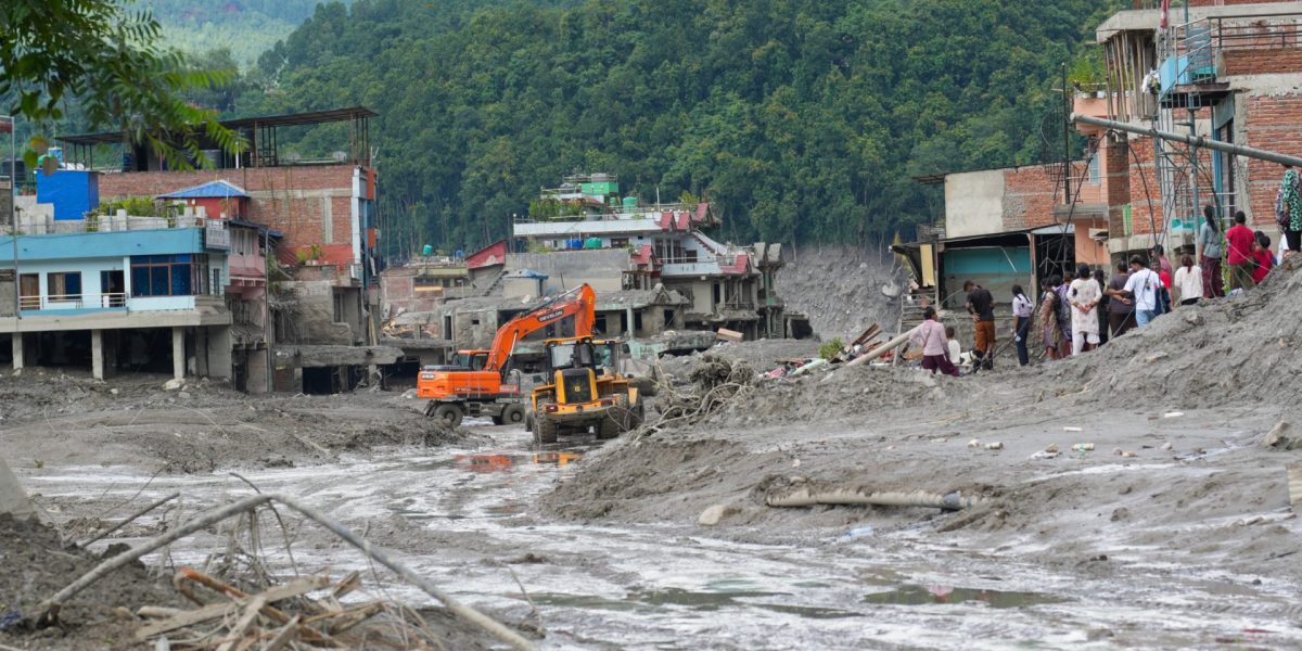 NUWAKOT, NEPAL- AUGUST 27: Earthmovers clear debris from Trishuli Bazaar in Nuwakot district, Nepal, on August 27, 2026, following devastating flash floods near the Nepal??