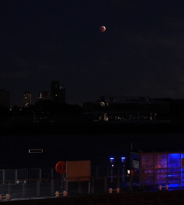 The partial lunar eclipse of the August full moon, known as the Sturgeon Moon, is seen in the skies over Masthouse Terrace Pier on the Isle of Dogs, London. Picture date: Friday August 28, 2026. PA Photo. Photo credit should read: Yui Mok/PA Wire