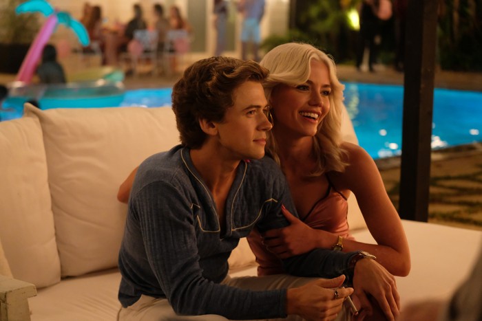 Igby Rigney as Bret, Hayes Warner as Debbie Schaffer seated by a pool in The Shards.