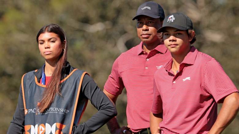 Tiger Woods of the United States with his son Charlie Woods and daughter Sam Woods prepare to tee off from the second tee during the second round of the PNC Championship at Ritz-Carlton Golf Club on December 22, 2024