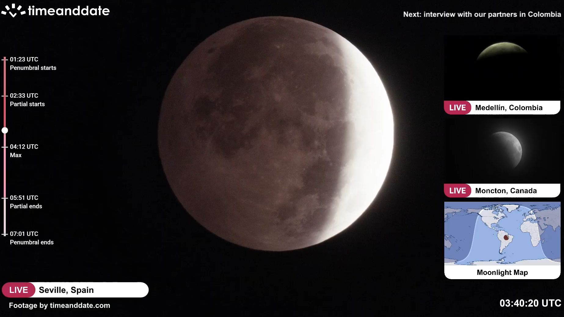 close up view of the moon in the night sky with a darker region to the upper left - the umbra has started moving onto the moon..