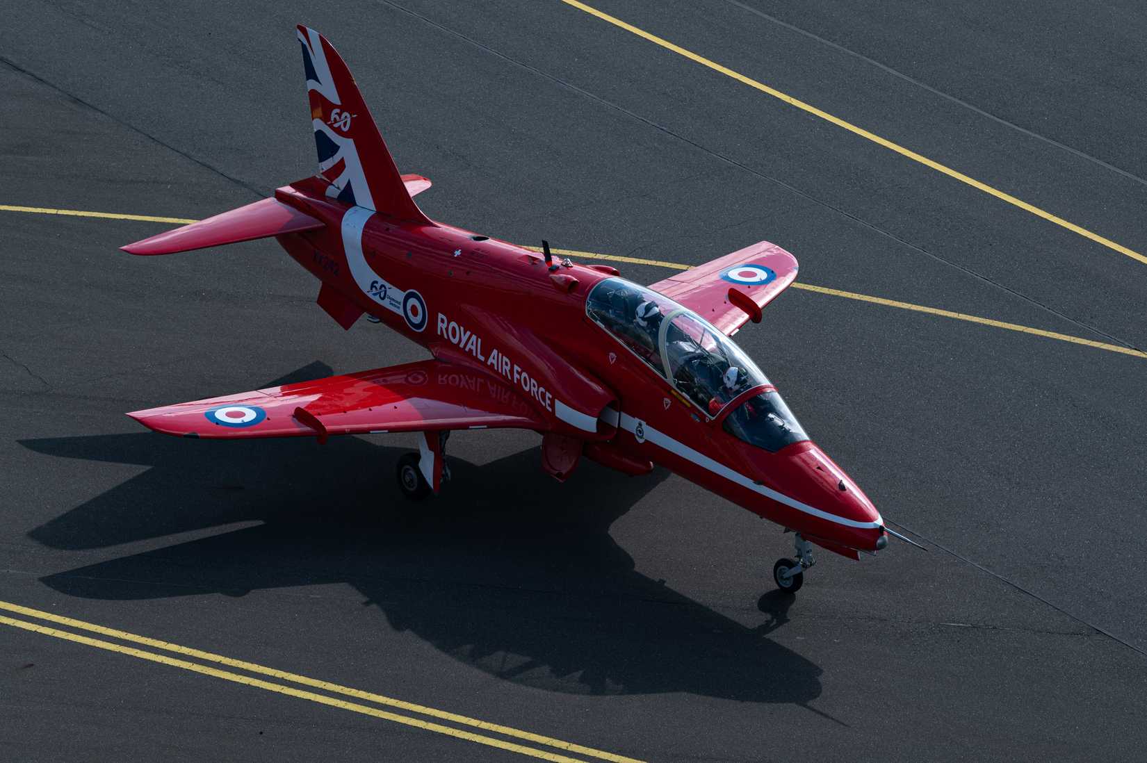 A Hawk T1 with the Royal Air Force Aerobatic Team, the Red Arrows, taxis along the flight line.