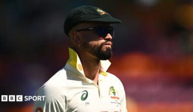 Australia's Jake Weatherald in the field during a Test match. He is wearing his baggy green cap, sunglasses and has the collars of his white shirt turned up.