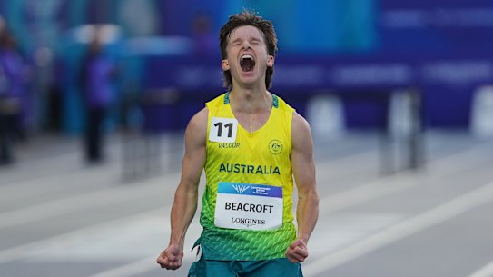 Isaac Beacroft celebrates after crossing the finish line in the men’s 10,000m race walk final.