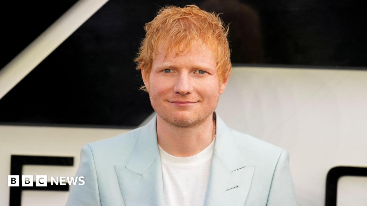 ed sheeran in a pale blue suit