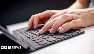 Library picture of two hands typing on a laptop
