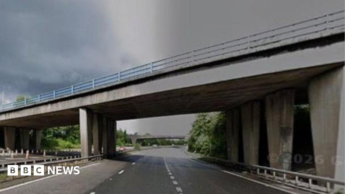 A motorway bridge over an empty M67