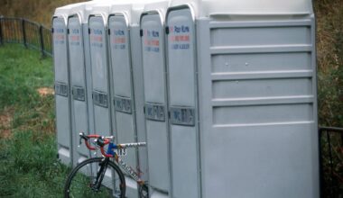 A bike sits between portaloos at the Vuleta in 2001