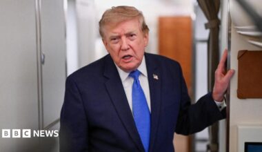 US President Donald Trump speaks to the media aboard Air Force One en route to Joint Base Andrews.