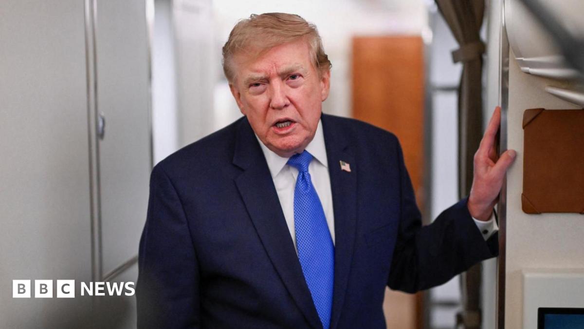 US President Donald Trump speaks to the media aboard Air Force One en route to Joint Base Andrews.