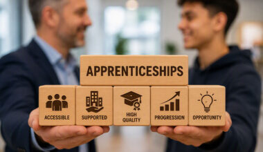 Apprentice and business owner holding six wooden blocks