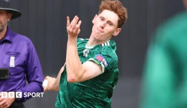 James Hayes is bowling a ball while playing in the green shirt of Nottinghamshire.