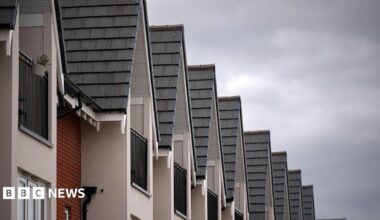 The tops of new build houses standing in a  row