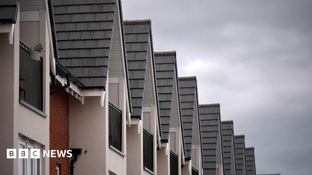 The tops of new build houses standing in a  row
