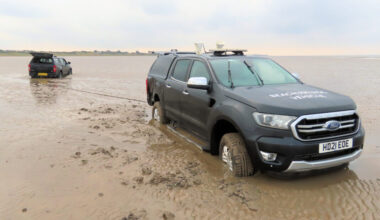 Recovery crews pull two stranded Brean beach warden trucks to safety using WW2 Scammell Pioneer