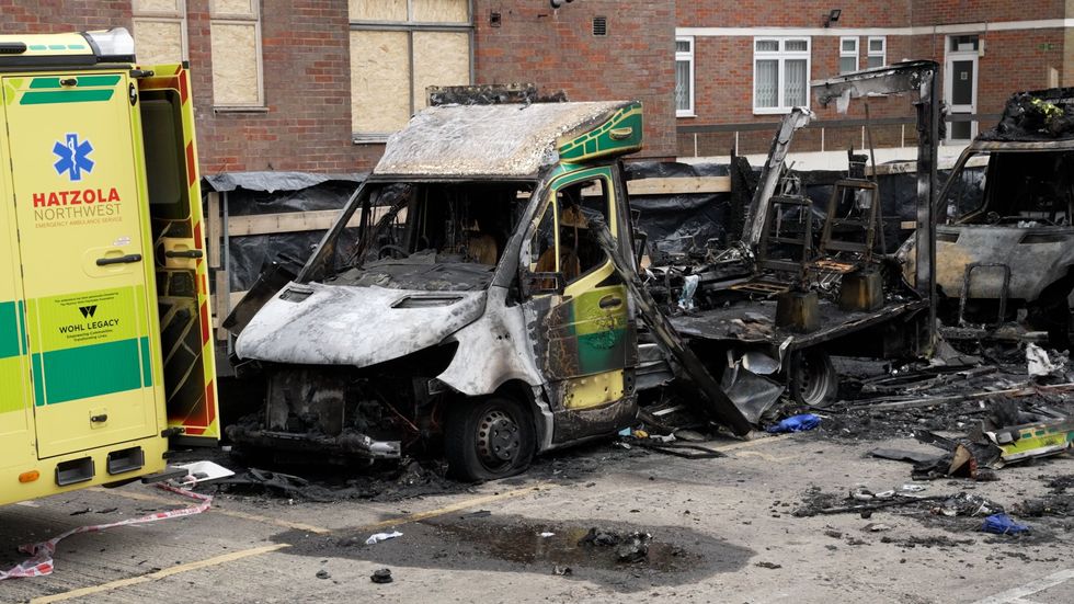 Burnt-out remains of Hatzola ambulances at the Jewish Community Ambulance service in Golders Green