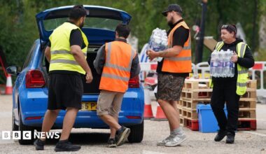 Water bottles are handed out at the Weald Sports Centre