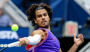 Carlos Alcaraz hits a return at the 2026 US Open