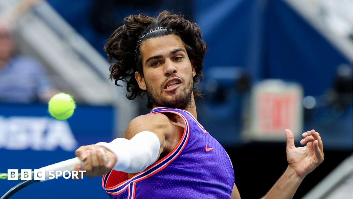 Carlos Alcaraz hits a return at the 2026 US Open