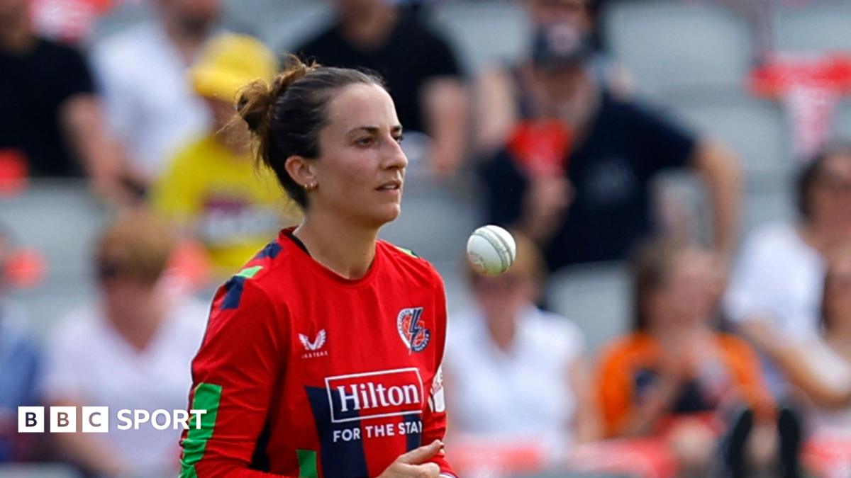 Fi Morris tossing the ball as she prepares to bowl for Lancashire