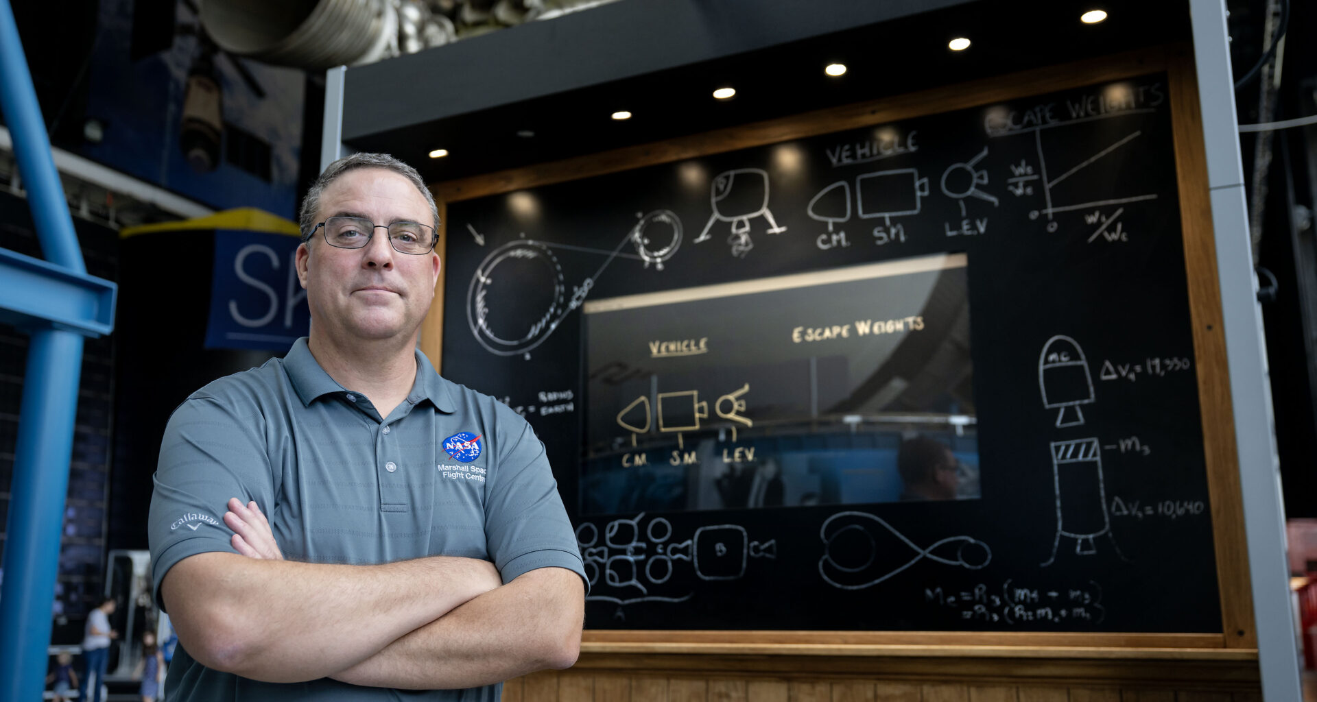 Tom Percy, manager of systems engineering and integration for NASA’s Human Landing Systems Program, stands in front of an Apollo Program lander exhibit at the U.S. Space and Rocket Center in Huntsville near NASA’s Marshall Space Flight Center.