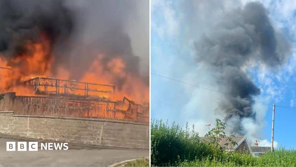 Two photos; one shows flames covering the front of a property and the other shows think black smoke rising high over homes