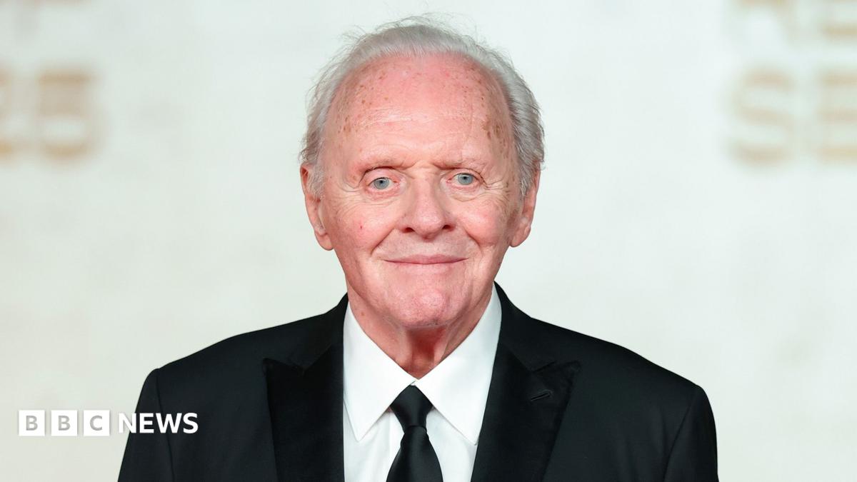 Sir Anthony Hopkins in a dark suit