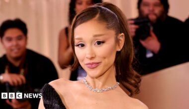 Ariana Grande poses for the cameras at the Golden Globes earlier this year. She is wearing a black dress and diamond necklace and has her hair in a ponytail.