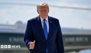 U.S. President Donald Trump gives thumbs-up as he walks from Marine One to board Air Force One.