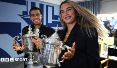 Carlos Alcaraz and Aryna Sabalenka pose with their US Open singles trophies