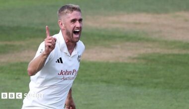 Olly Stone celebrates taking a wicket for Nottinghamshire.