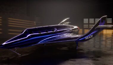a metallic dark-purple space plane sits inside a hangar