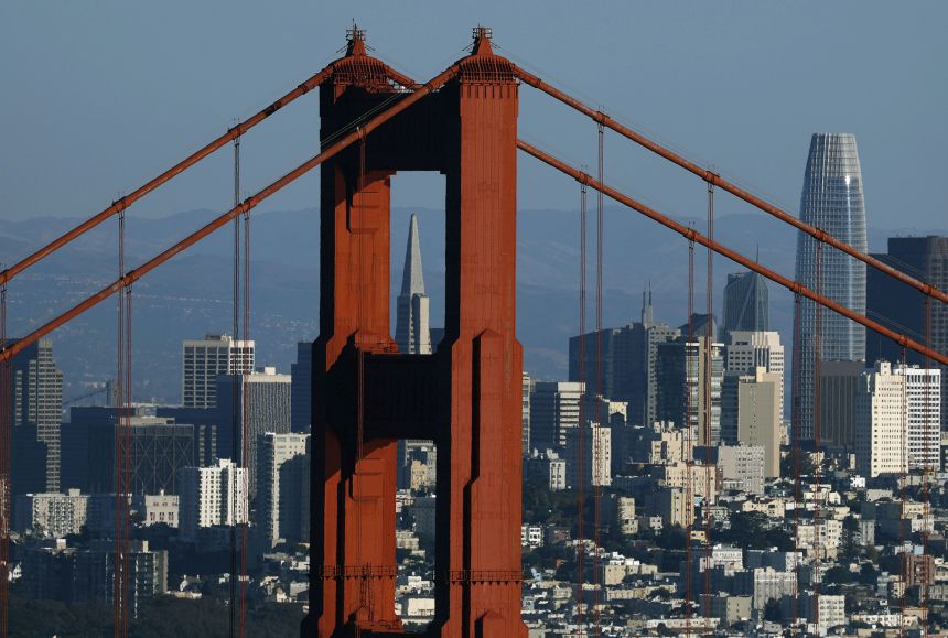 San Francisco's skyline is seen through the Golden Gate Bridge on October 20, 2025, in Sausalito, California.