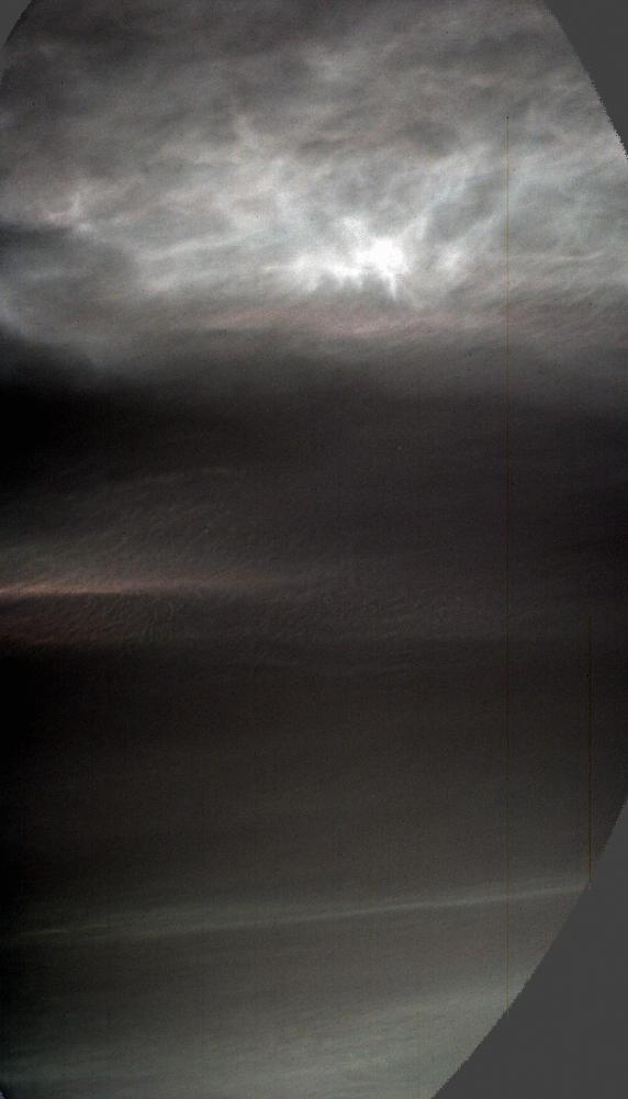 Iridescent twilight clouds photographed by NASA's Curiosity rover on Mars, glowing with mother-of-pearl colors against a darkening sky