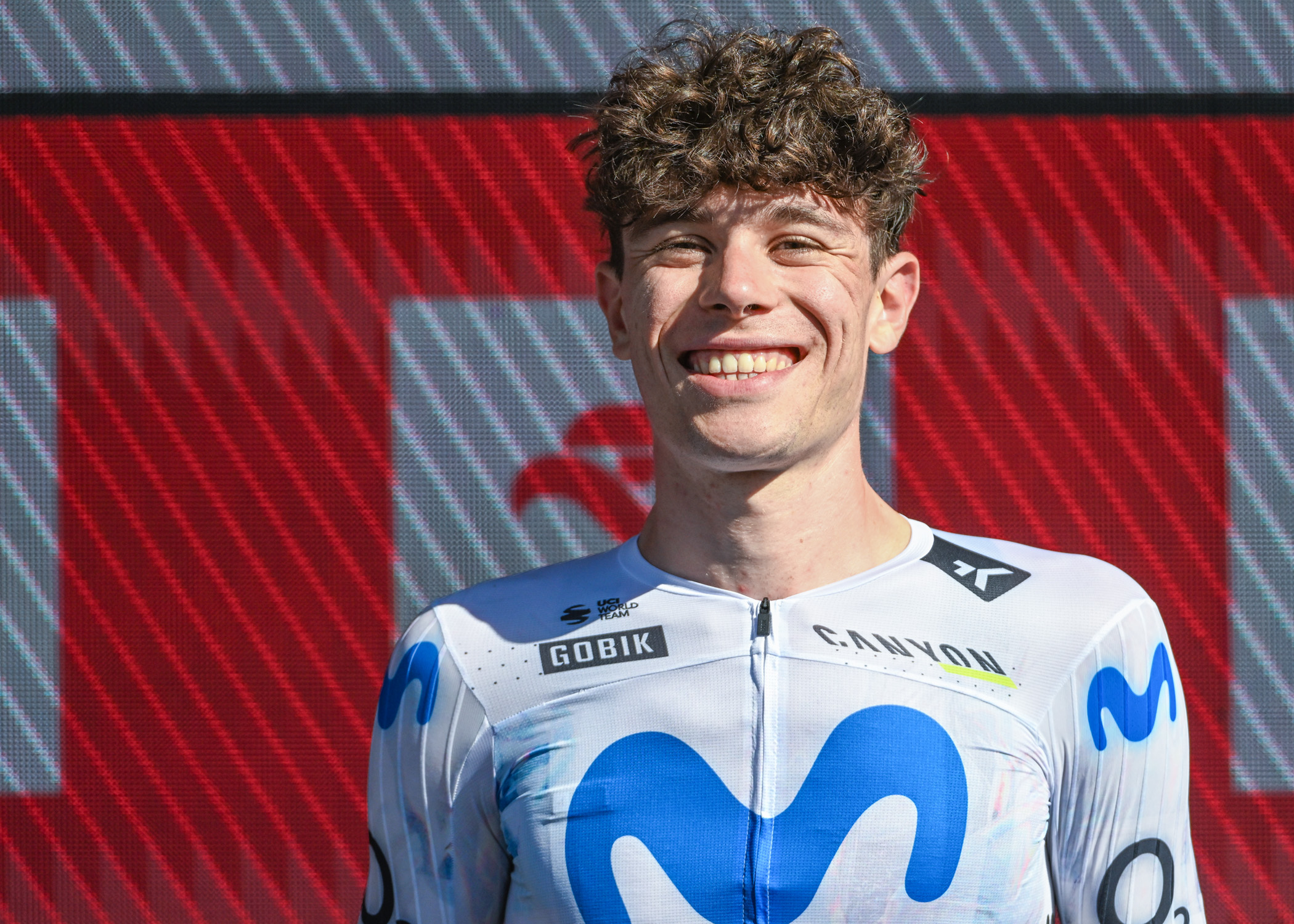 Iv&aacute;n Romeo celebrates on the podium after taking third place at the Tour de Pologne