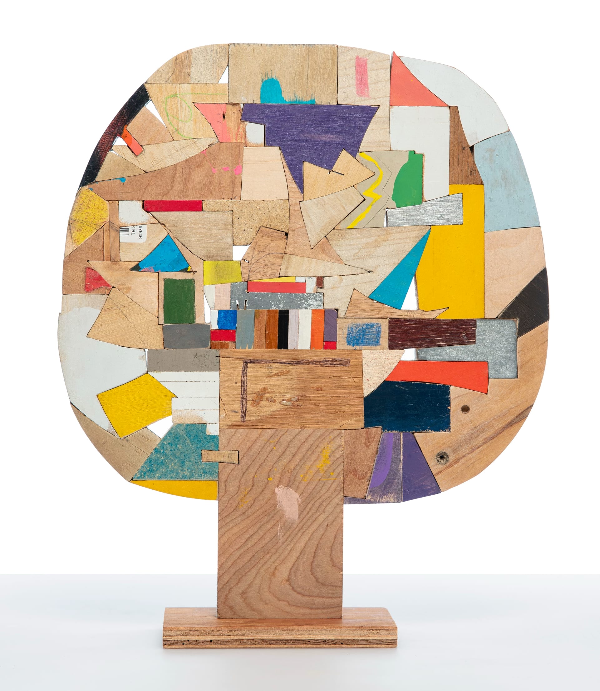 a small abstract wooden sculpture painted in vibrant colors by damien hoar de galvin
