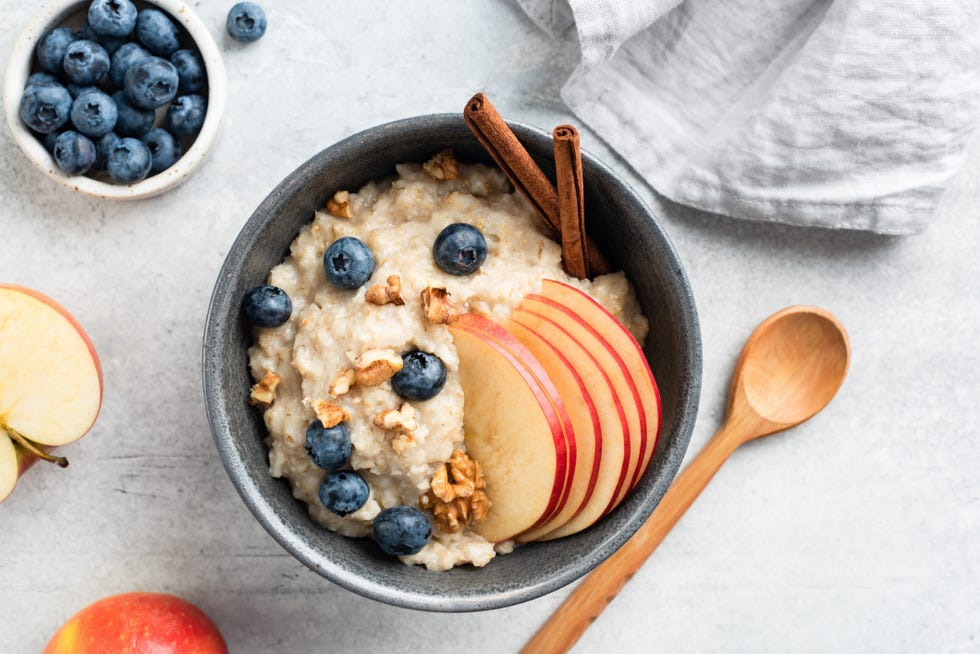 Oatmeal porridge with apple, cinnamon and blueberries oatmeal porridge with apple, cinnamon and blueberries